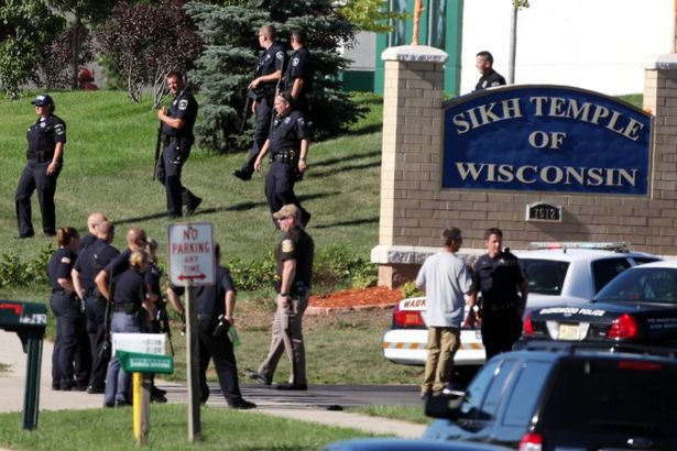 Police action during the shooting attack on the Sikh Temple of Wisconsin in August 2012. (source: Daily Record and Sunday Mail)