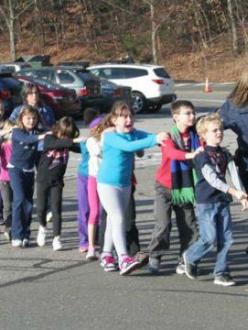Children are evacuated from their elementary school in Newtown, CT, after a shooter attacked on December 14, 2012. (source: CNN)