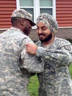 "Cpl. Simranpreet Lamba receives congratulations at his promotion ceremony on Joint Base Lewis-McChord Friday, Sept. 27. 2013." (Photo: Adam Ashton | News-Tribune)