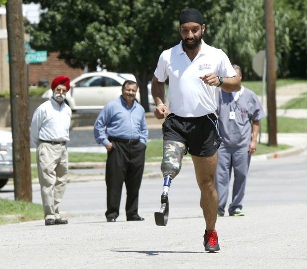 Maj. Devender Pal Singh, an amputee marathon runner from India, tries out a new prosthetic leg outside the Hanger Clinic, 4301 N Classen in Oklahoma City. (Photo Credit: Paul Hellstern | Oklahoman)