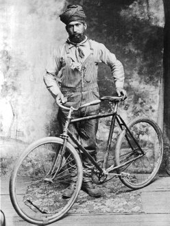 Heara Singh with bicycle, Crawfordsville, Oregon, c. 1900s. (Credit: Stephen Williamson)