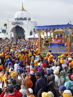 "Thousands of people surround the Guru Granth Sahib, or Sikh holy scriptures, on the main float during the 34th annual Nagar Kirtan and Sikh Parade in Yuba City Sunday, Nov. 3, 2013." (Photo: David Bitton/Appeal-Democrat)